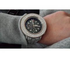 Serious iced out Breitling Super Avenger